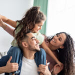 Cheerful,Middle,Eastern,Family,Of,Three,Having,Fun,Together,At