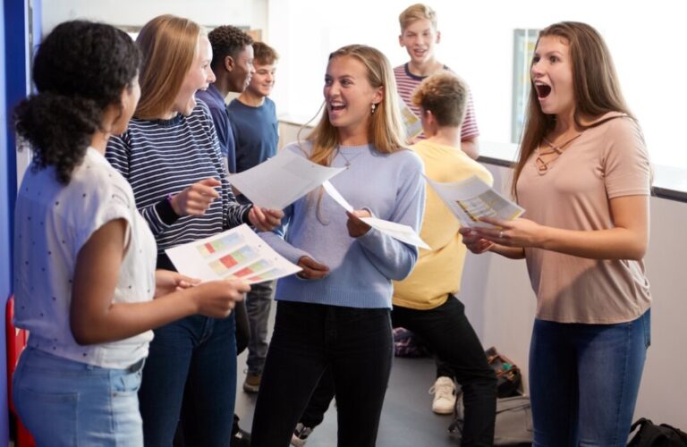 Excited,Teenage,High,School,Students,Celebrating,Exam,Results,In,School