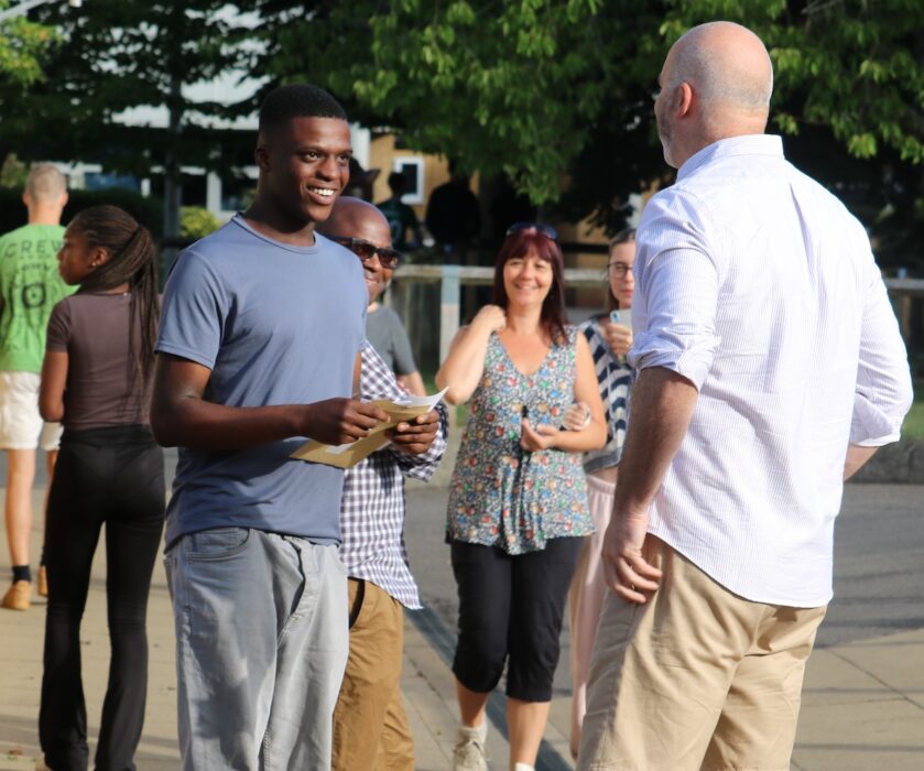 1. michael agyepong is congratulated by sheldon headteacher, pete lynch, after his fantastic results secure a place at university of bristol to study aerospace engineering (1)