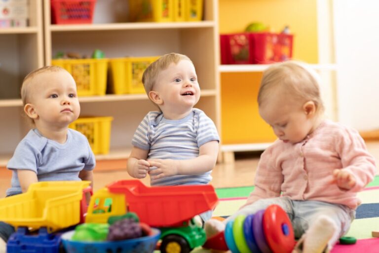 Little,toddlers,boys,and,a,girl,playing,together,in,kindergarten