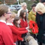 Monkton park primary pupils present their wreath to hm queen camilla (1)