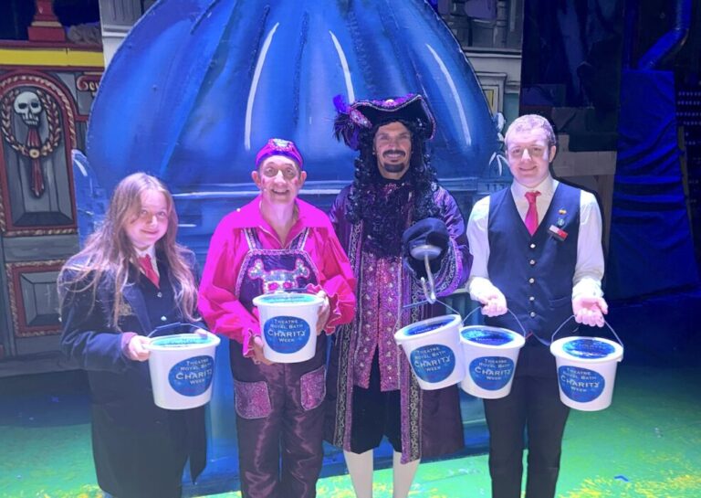 Bath pantomime stars and trb front of house team celebrate total raised by charity collections