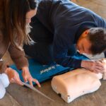 Parents practise child emergency response skills on a Nurture Knowledge child health course