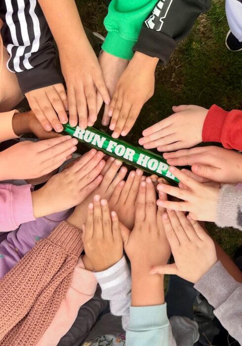 Over 400 pupils at Moredon Primary ran a mile for HOPE, raising awareness of domestic abuse and celebrating their HOPE Award.