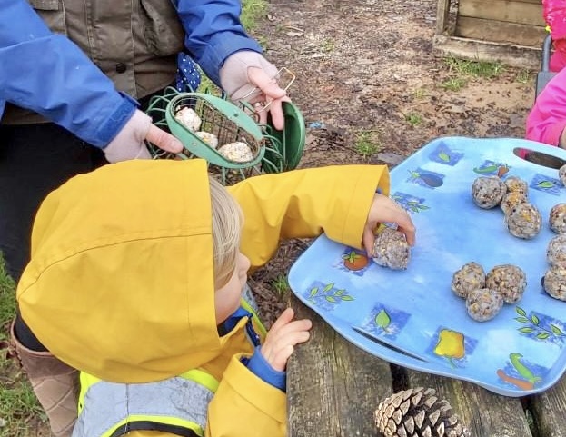Freshford Preschool children near Bath earn Ruby Robin Award from SongBird Survival after helping protect local songbirds through crafts and outdoor learning.
