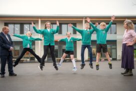 Pupils outside the new energy-efficient classrooms at St Keyna Primary School in Keynsham after the school’s £5.3m expansion