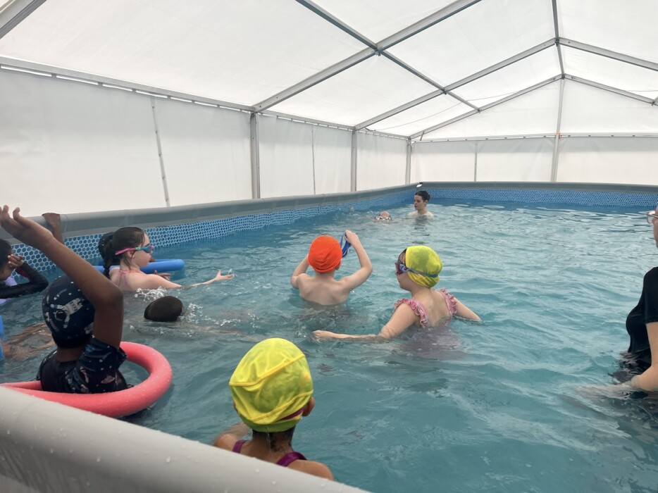St Philip’s School Bath installs a temporary pool so every pupil can learn to swim on site, supported by Olympian Sharron Davies.