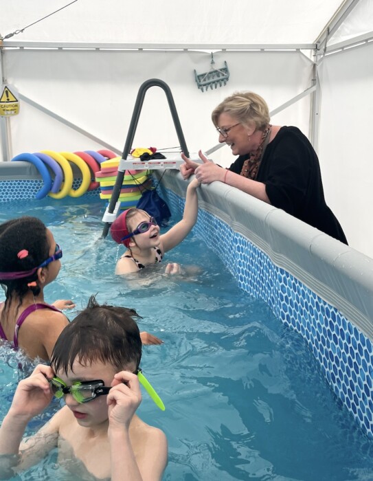 St Philip’s School Bath installs a temporary pool so every pupil can learn to swim on site, supported by Olympian Sharron Davies.