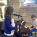 Pupils from Marksbury and Farmborough primary schools opened the Three Towers Festival with joyful performances celebrating music, confidence and community.