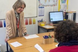 Wera Hobhouse talking to a student and teaching assistant