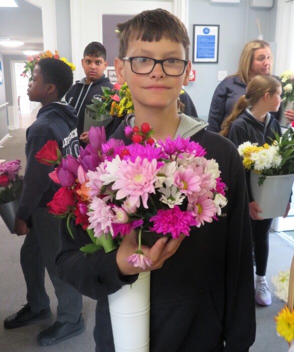 Year 6 pupils from Christ the King Catholic School in Amesbury visited Buckland Court care home, sharing flowers, stories and companionship with residents.