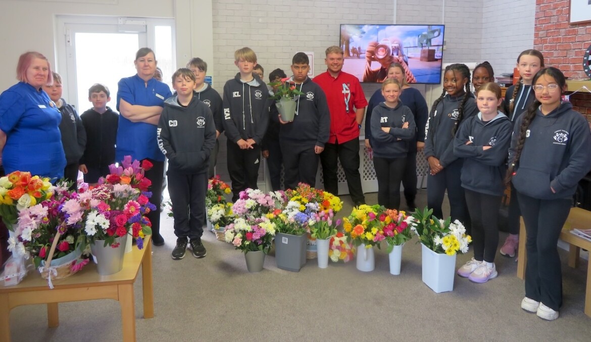Year 6 pupils from Christ the King Catholic School in Amesbury visited Buckland Court care home, sharing flowers, stories and companionship with residents.