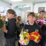 Year 6 pupils from Christ the King Catholic School in Amesbury visited Buckland Court care home, sharing flowers, stories and companionship with residents.