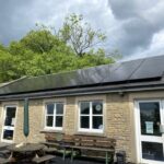Marksbury CofE Primary School near Bath has installed solar panels and energy-efficient heating, helping cut costs and teach pupils about renewable energy.
