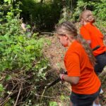 More than 40 One Church Keynsham volunteers have transformed an overgrown garden at Lift Broadlands into a new outdoor space for students.