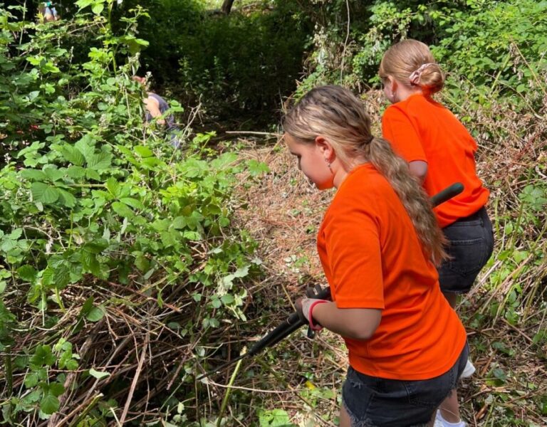More than 40 One Church Keynsham volunteers have transformed an overgrown garden at Lift Broadlands into a new outdoor space for students.