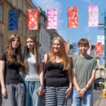 Zandra Rhodes-inspired designs by students from four Bath schools and colleges have been turned into colourful banners and bunting across the Milsom Quarter.