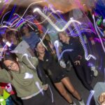 More than 350 people joined the RUHX Glow Run at Odd Down Sports Ground in Bath, raising over £18,000 to support patients at the Royal United Hospital.