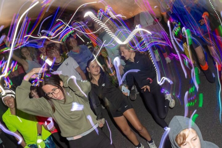 More than 350 people joined the RUHX Glow Run at Odd Down Sports Ground in Bath, raising over £18,000 to support patients at the Royal United Hospital.