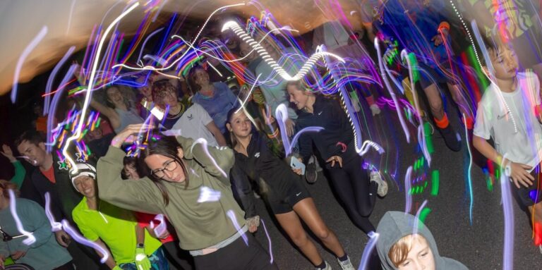 More than 350 people joined the RUHX Glow Run at Odd Down Sports Ground in Bath, raising over £18,000 to support patients at the Royal United Hospital.